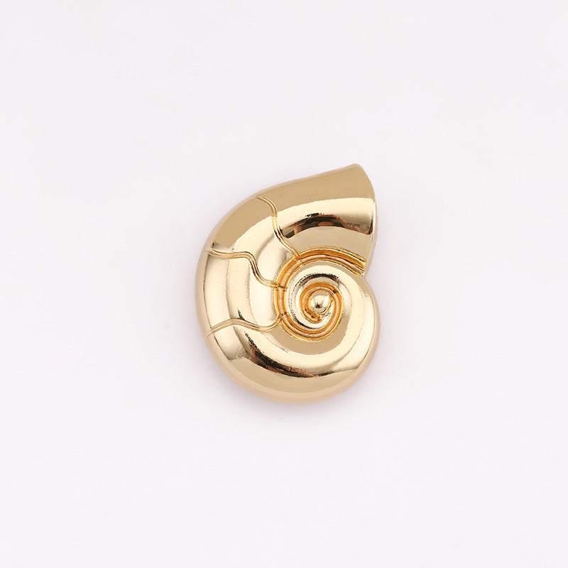 Snail-shaped metal shank button, light gold front with spiral centerpiece