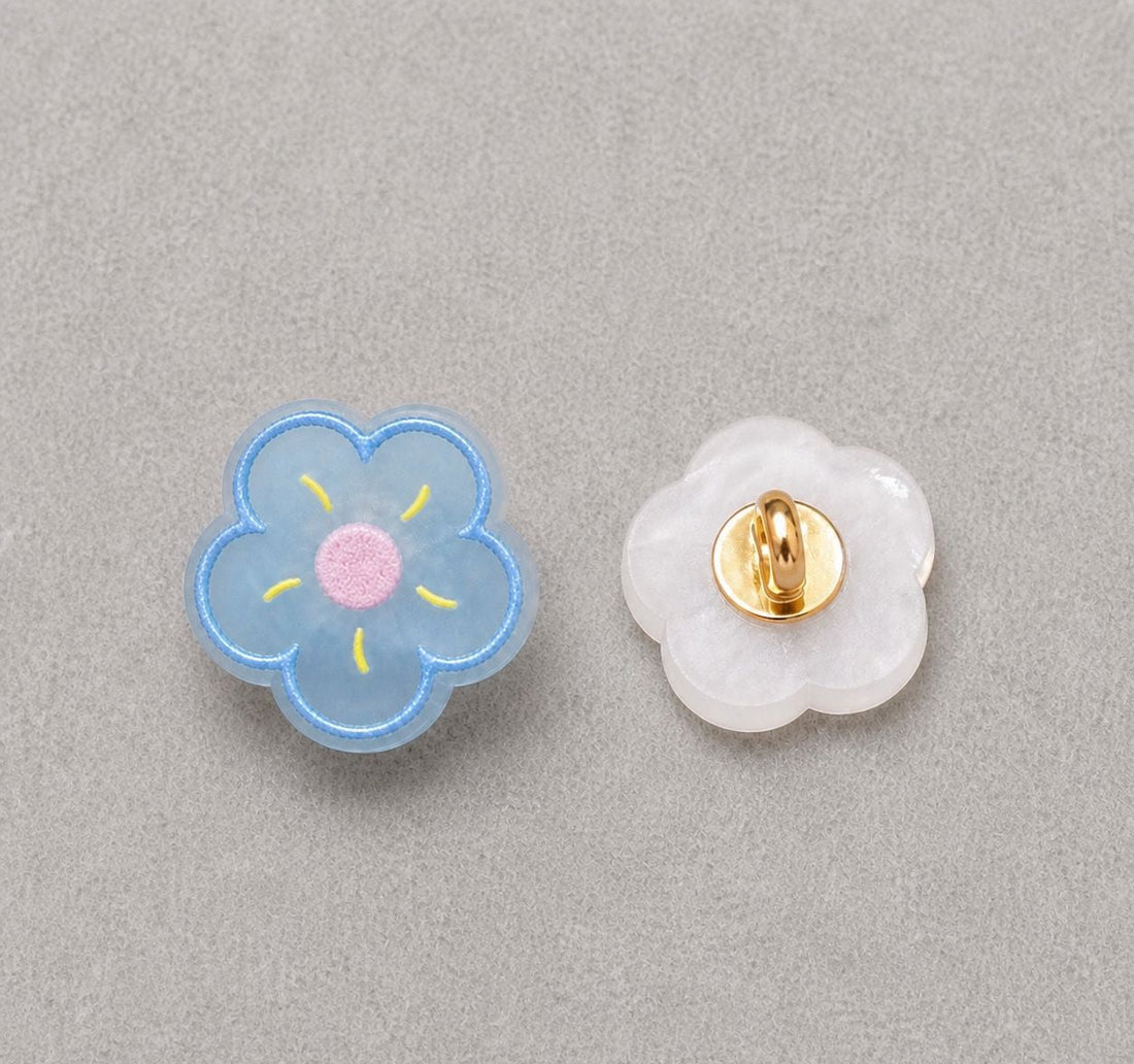 Floral resin shank button set: yellow flower front, translucent back