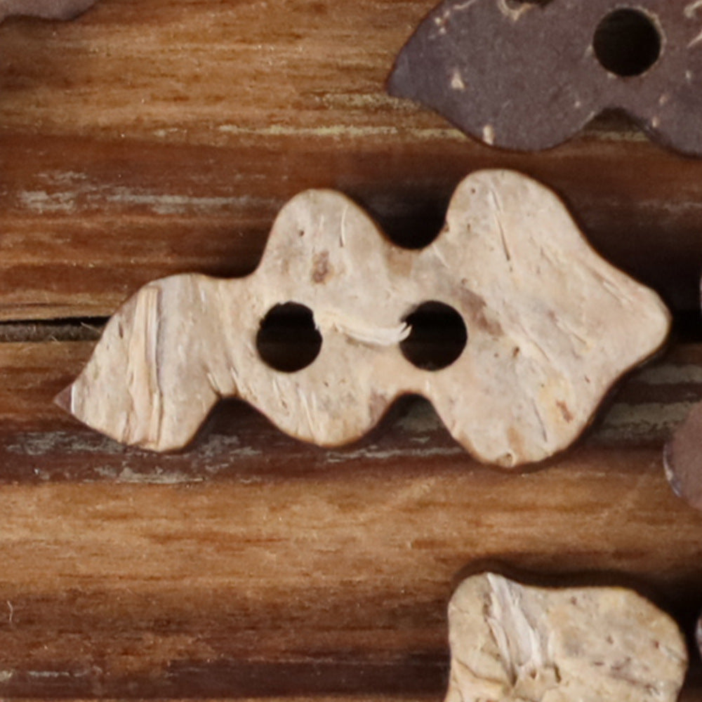 Coconut shell novelty buttons in dark and light tones with two holes