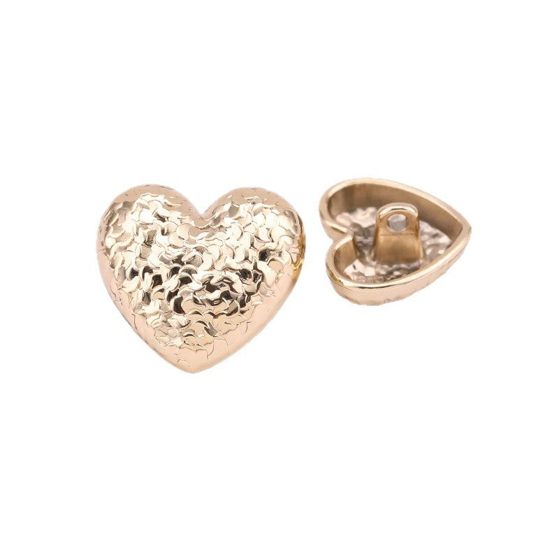 Heart-shaped textured metal shank button, light gold hammered scale pattern