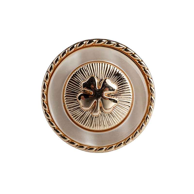 Beige resin button with four-leaf clover design, gold border and metal shank