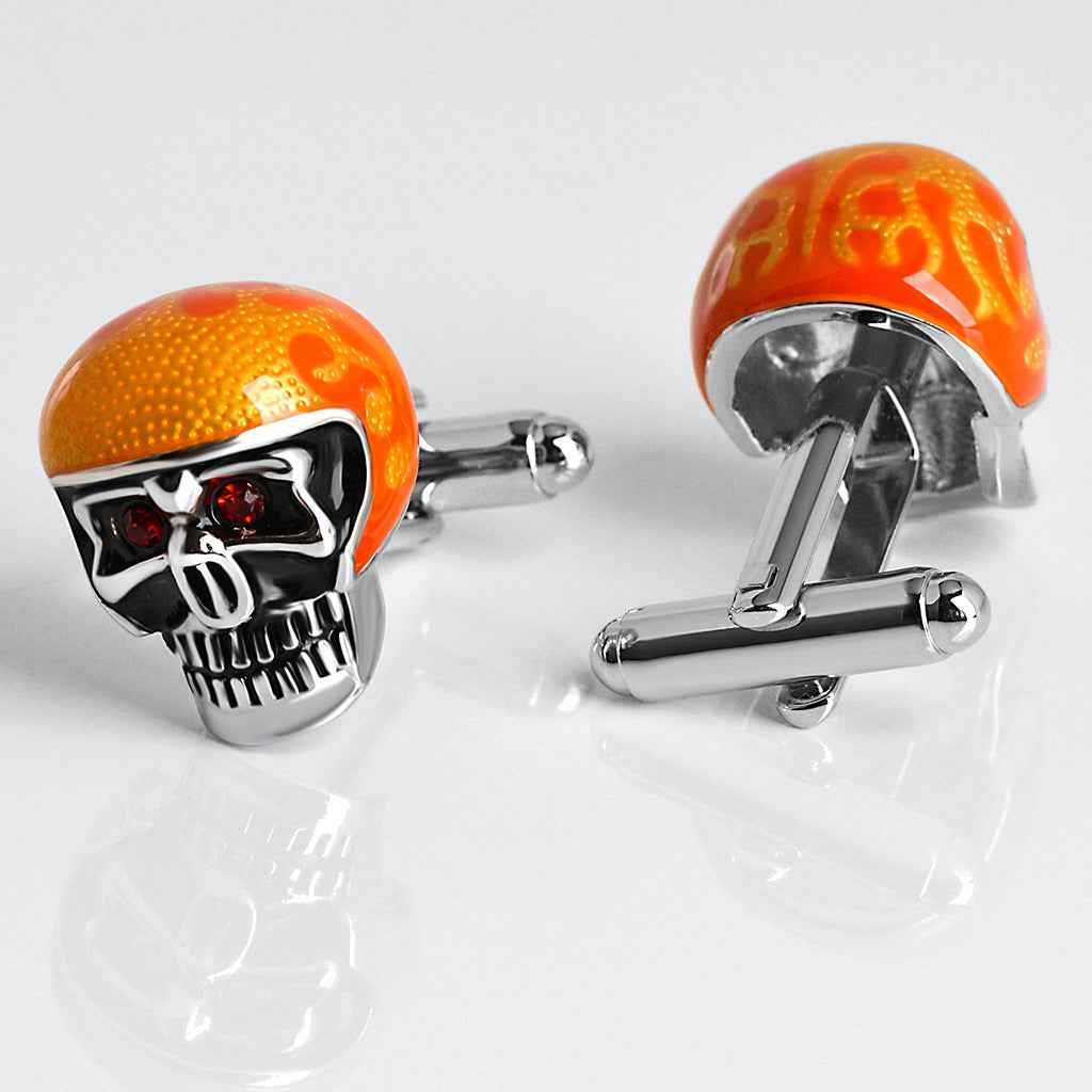 Glänzende orange Skull-Manschettenknöpfe mit schwarzen Emalldetails, roten Augen