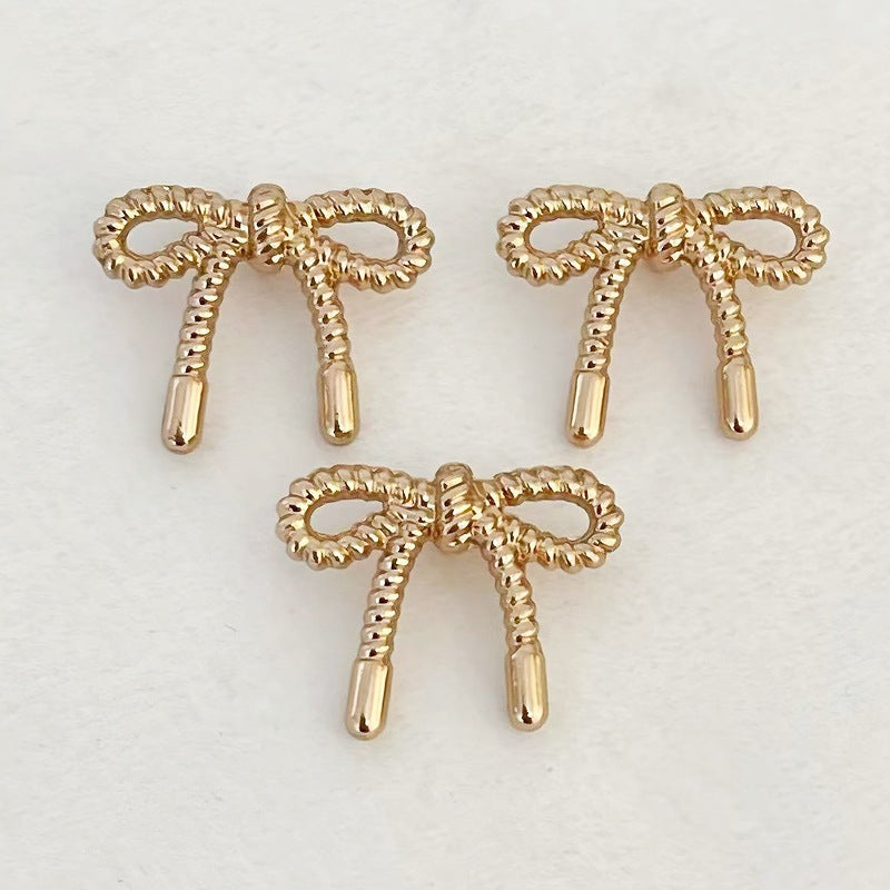 Lace Butterfly hollow metal buttons, gold tone bow design, thin edge detail