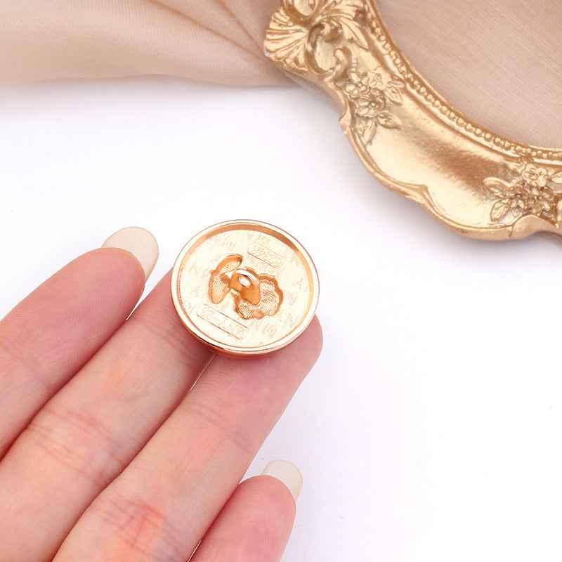 Round metal rose shank button, gold rim and light gold/ivory face with embossed rose