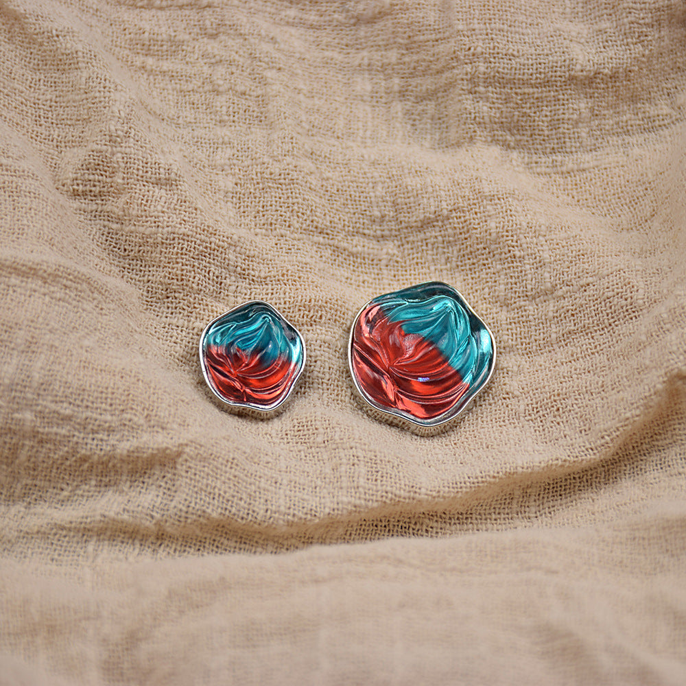 Transparent floral resin buttons, teal and red marbled with metal frames