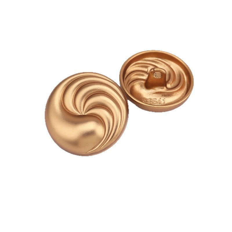 Sand gold spiral textured round metal shank button pair, front view with swirl texture
