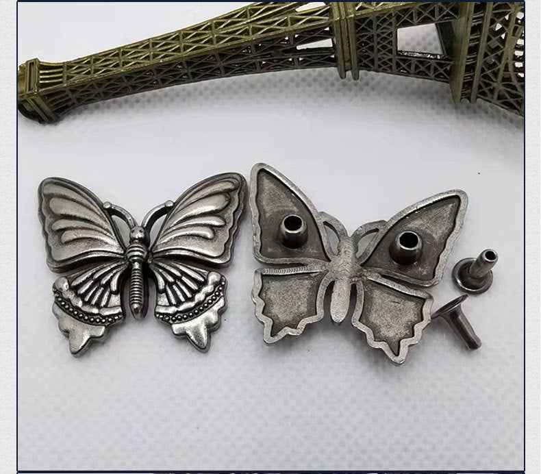 Antique silver butterfly rivet stud buttons set with round holes and prongs