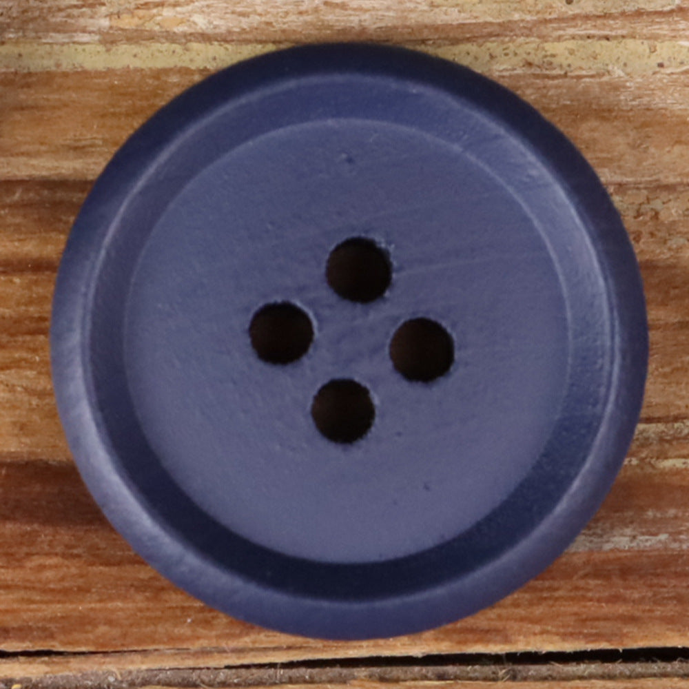 Blue-purple round wood button with four holes, close-up