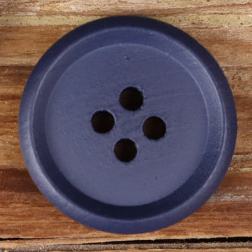 Blue-purple round wood button with four holes, close-up