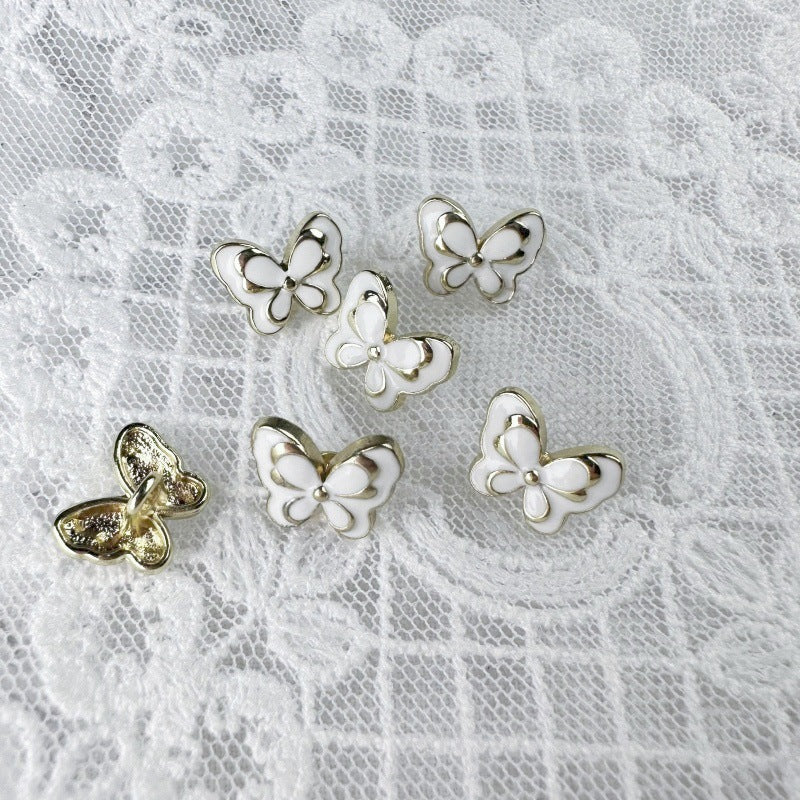 12mm butterfly metal buttons set: black and white enamel, gold-toned back loops