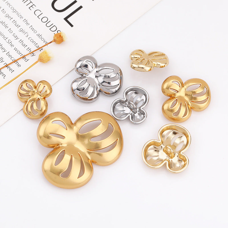 Assorted hollow flower metal shank buttons in gold and silver tones, multiple sizes
