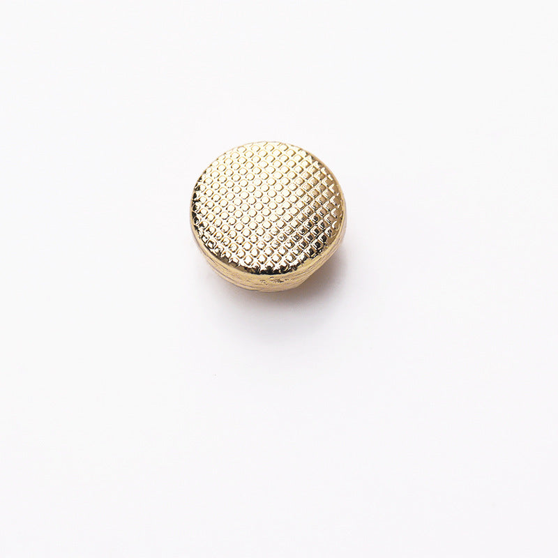 Gold round metal button, grid texture front, shank underside