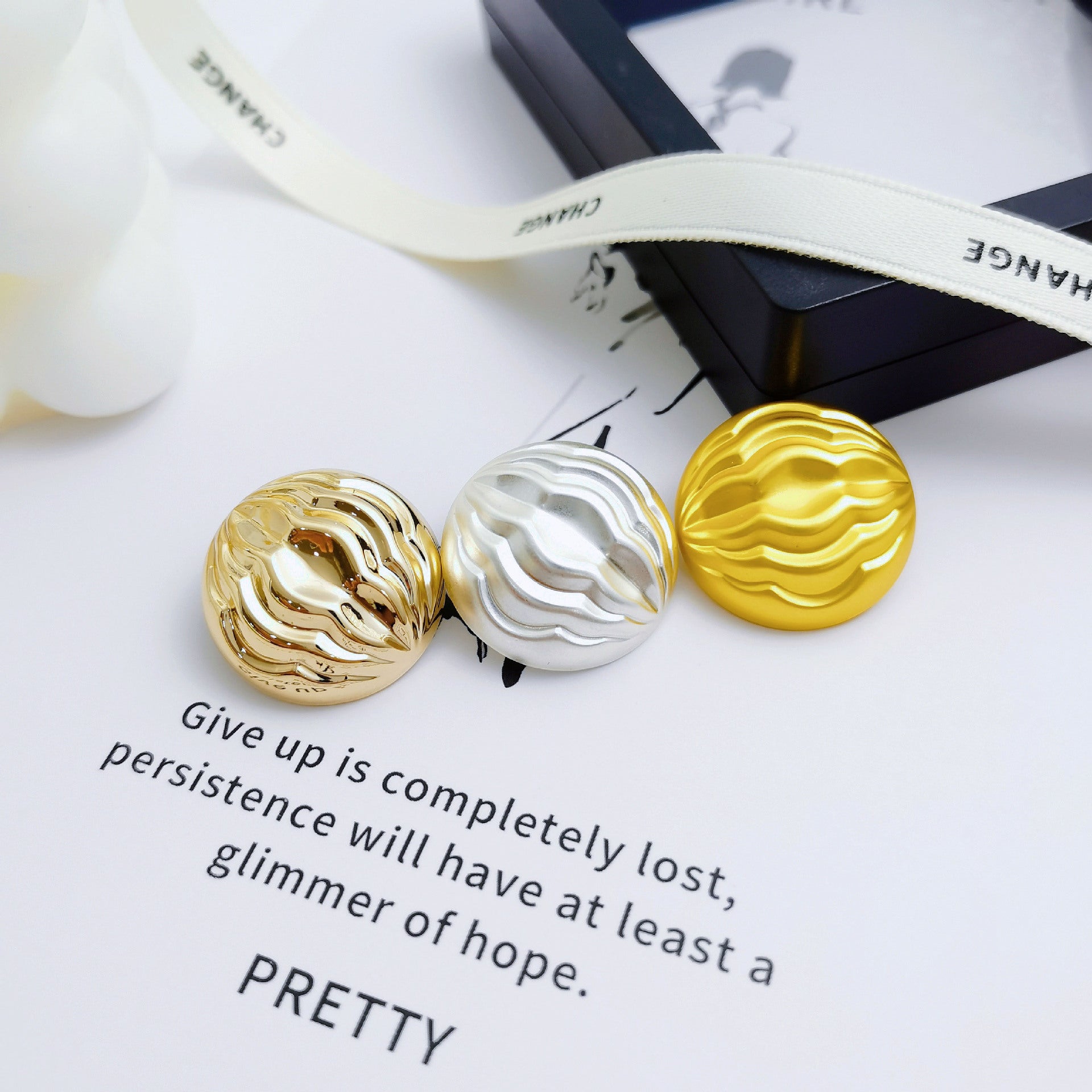 Pleated mushroom metal shank buttons, gold and silver round shank buttons shown