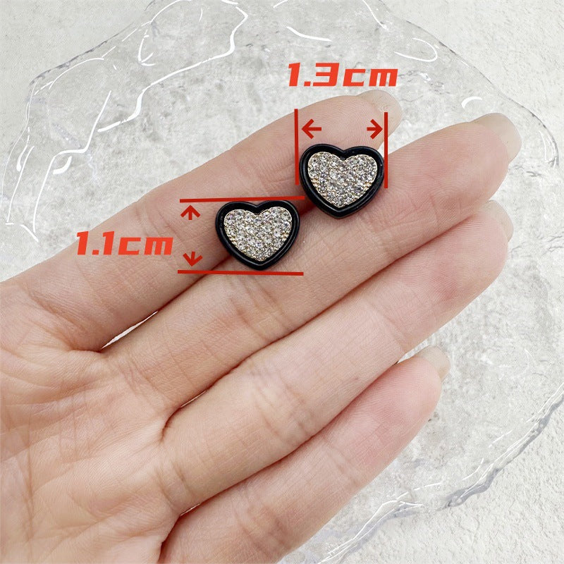 Heart-shaped rhinestone button with black trim; size guide shows ~13mm