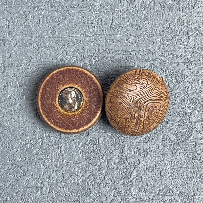 Round wood shank button with dark coffee rim, metal shank, carved mushroom grain
