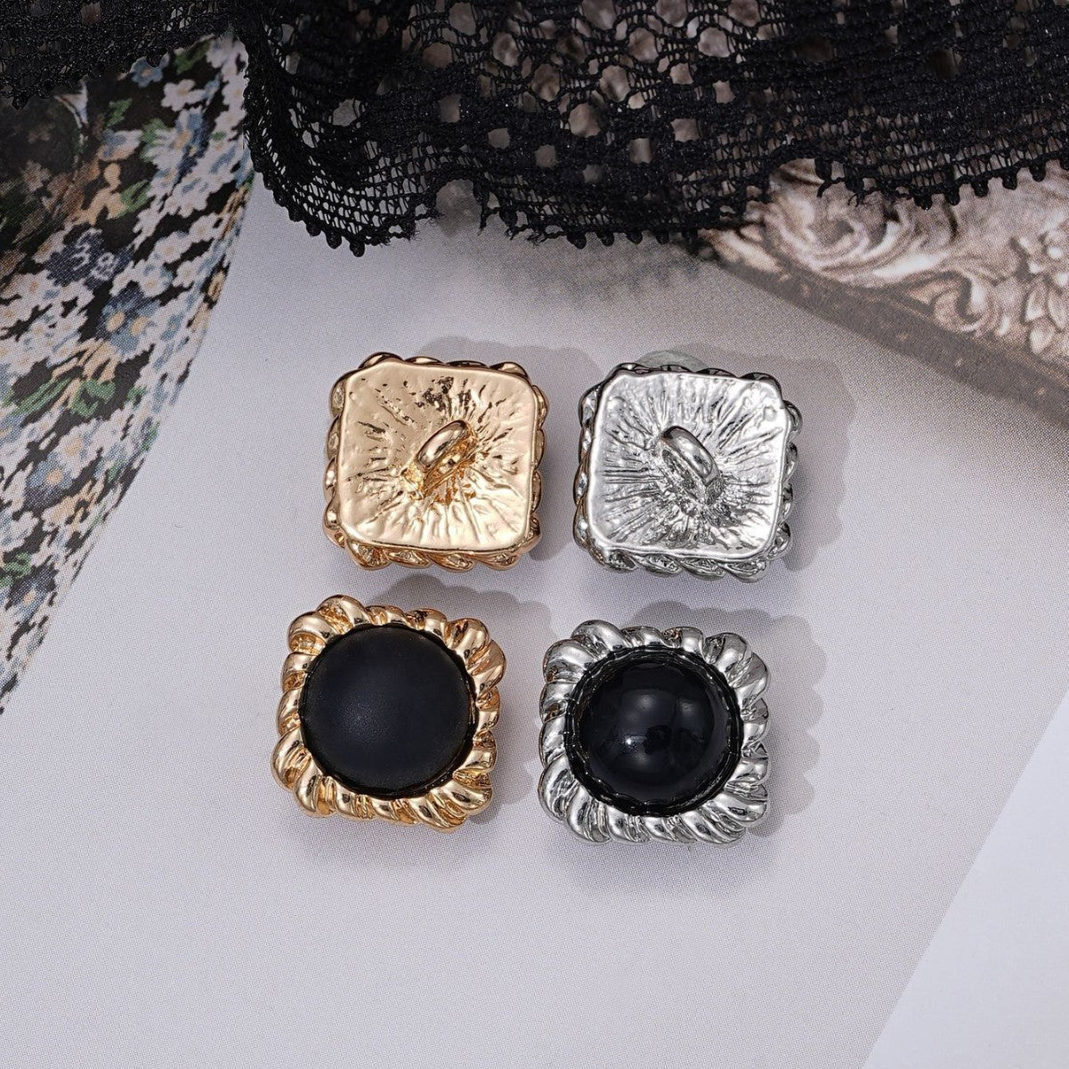 Square black pearl buttons, gold and silver fronts with ridged square frames