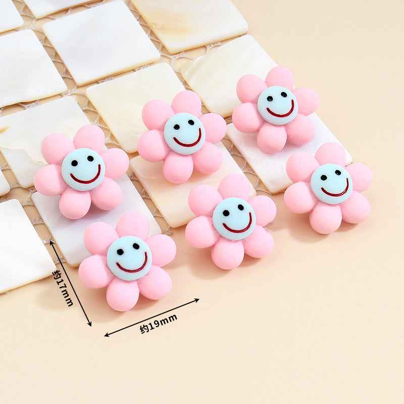 Pink smiley flower plastic buttons with metal shanks, about 19mm size