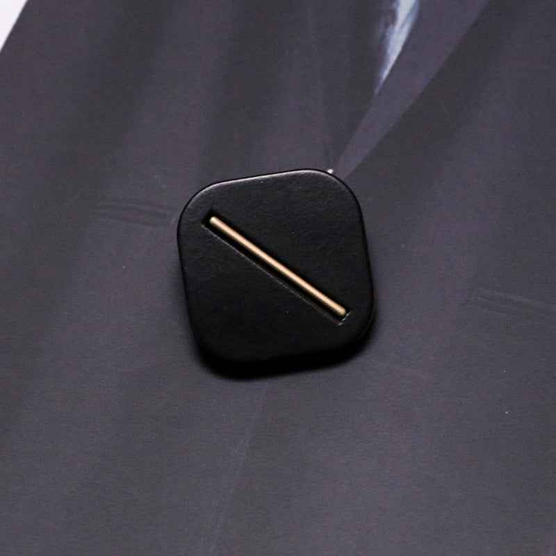 Black square resin shank button with metal base, single bar slot detail