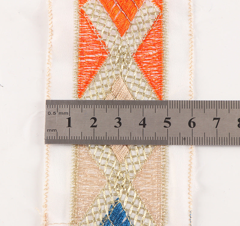 White mesh lace trim with X-shaped diamond embroidery, width shown by ruler