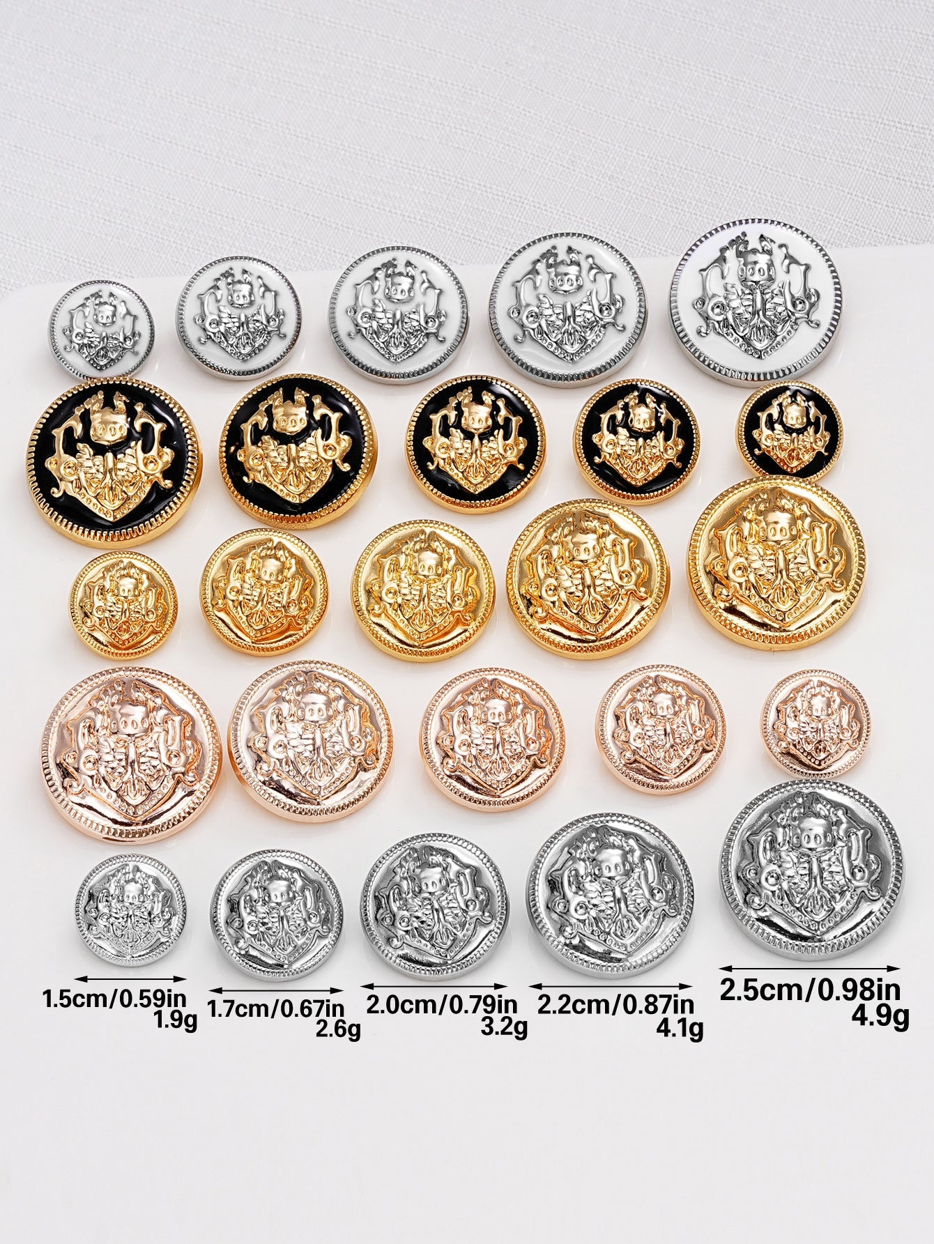 Mixed-size round metal shank buttons, embossed crest design in gold, silver, rose and dark