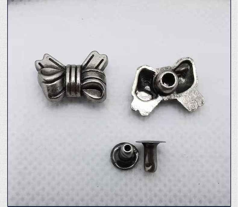 Metal bow rivet stud set: front bow with flanges and matching back post parts.