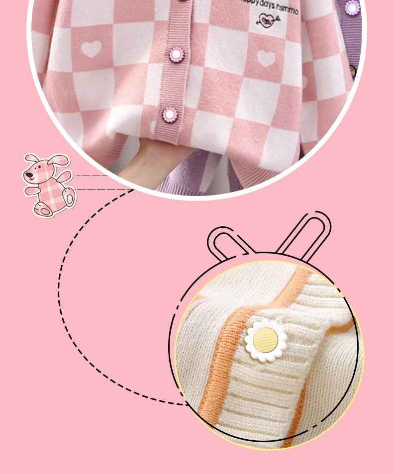 Close-up of cream knit with white sunflower shank button and yellow center pearl
