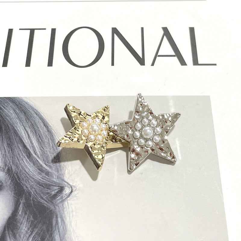 Gold and silver wavy star shank buttons with pearl accents (pair shown)