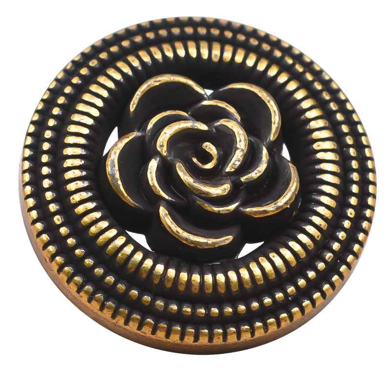 Vintage gold hollow rose metal button on black, beaded border and curled petal design