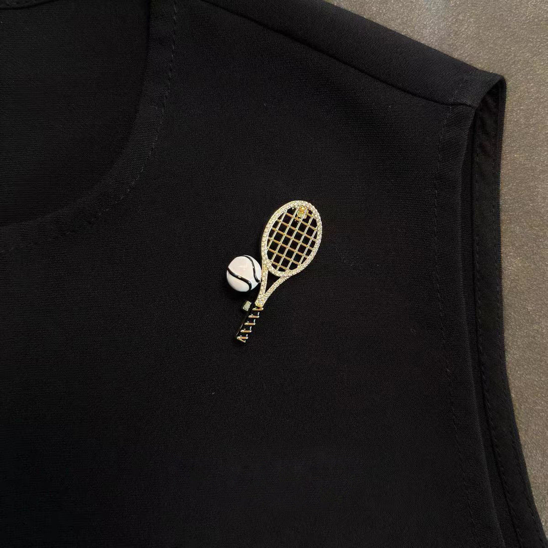 Tennis racket and ball enamel lapel pin, gold-tone net detail