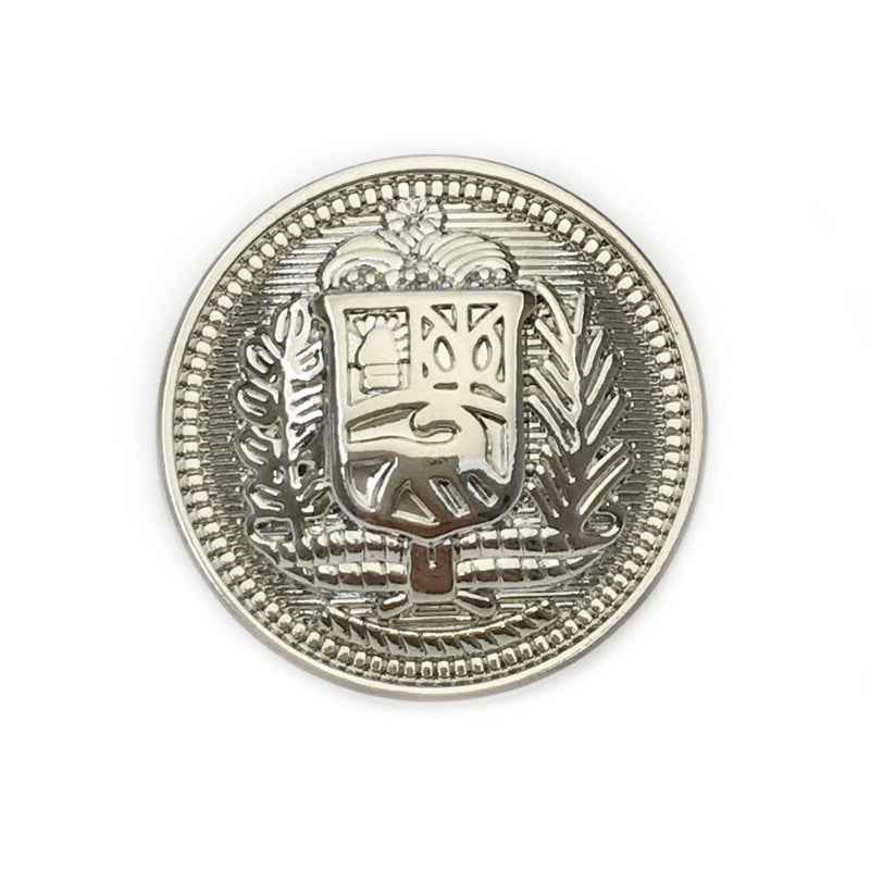 Round metal button with vintage knight shield design, silver front view.