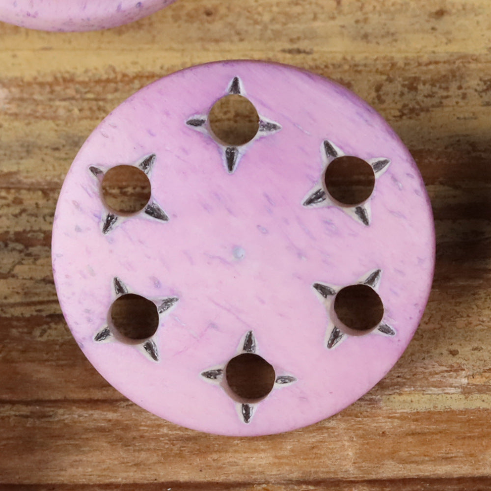 Light pink star-cutout horn shank button with metal shank and star-shaped cutouts