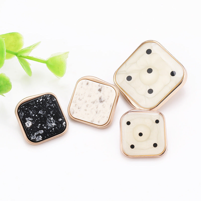 Square marble resin button set with gold frames: black, white, and cream fronts