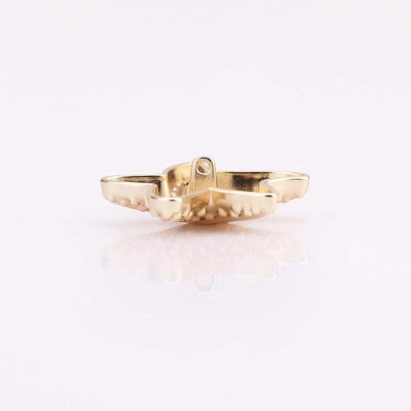 Light gold puffy starfish metal shank button underside with center loop