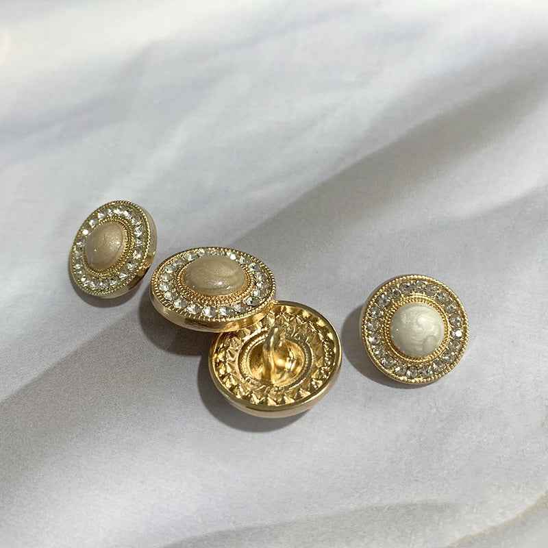 Gold-tone round buttons with rhinestone trim; includes button backs, beige centers