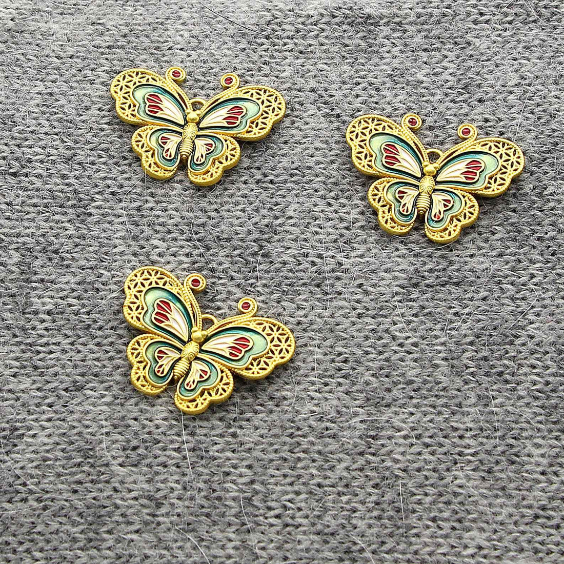 Chinese-style copper butterfly decorative button with multicolor enamel and 2 holes.