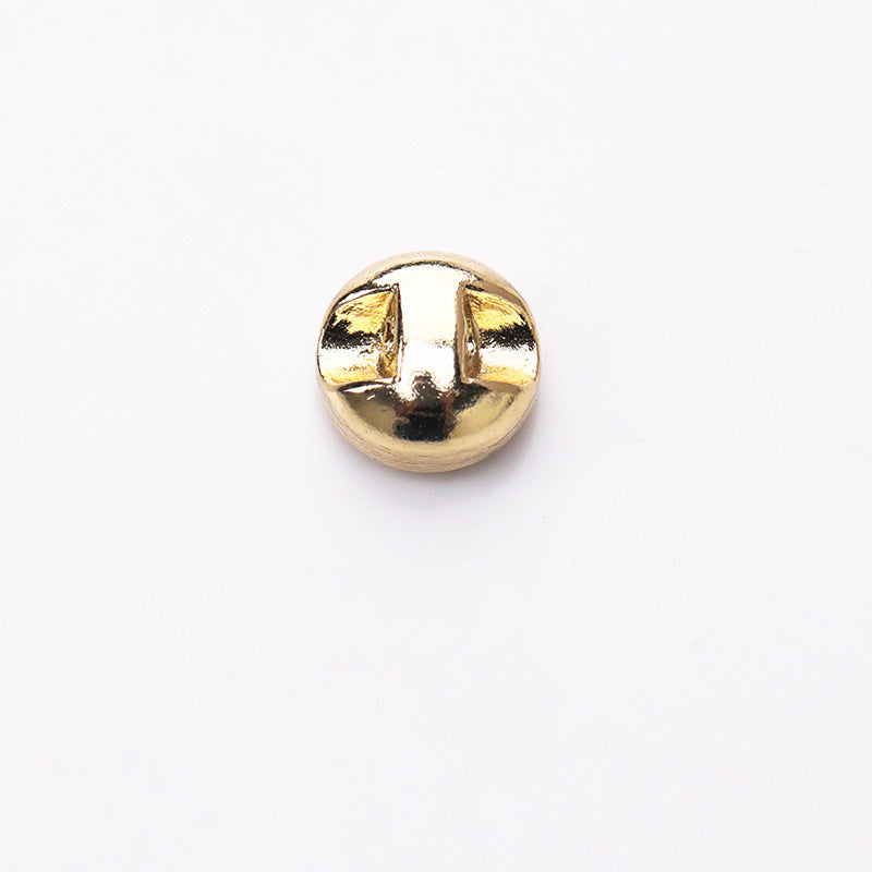 Gold metal shank button, flat round back with two prongs