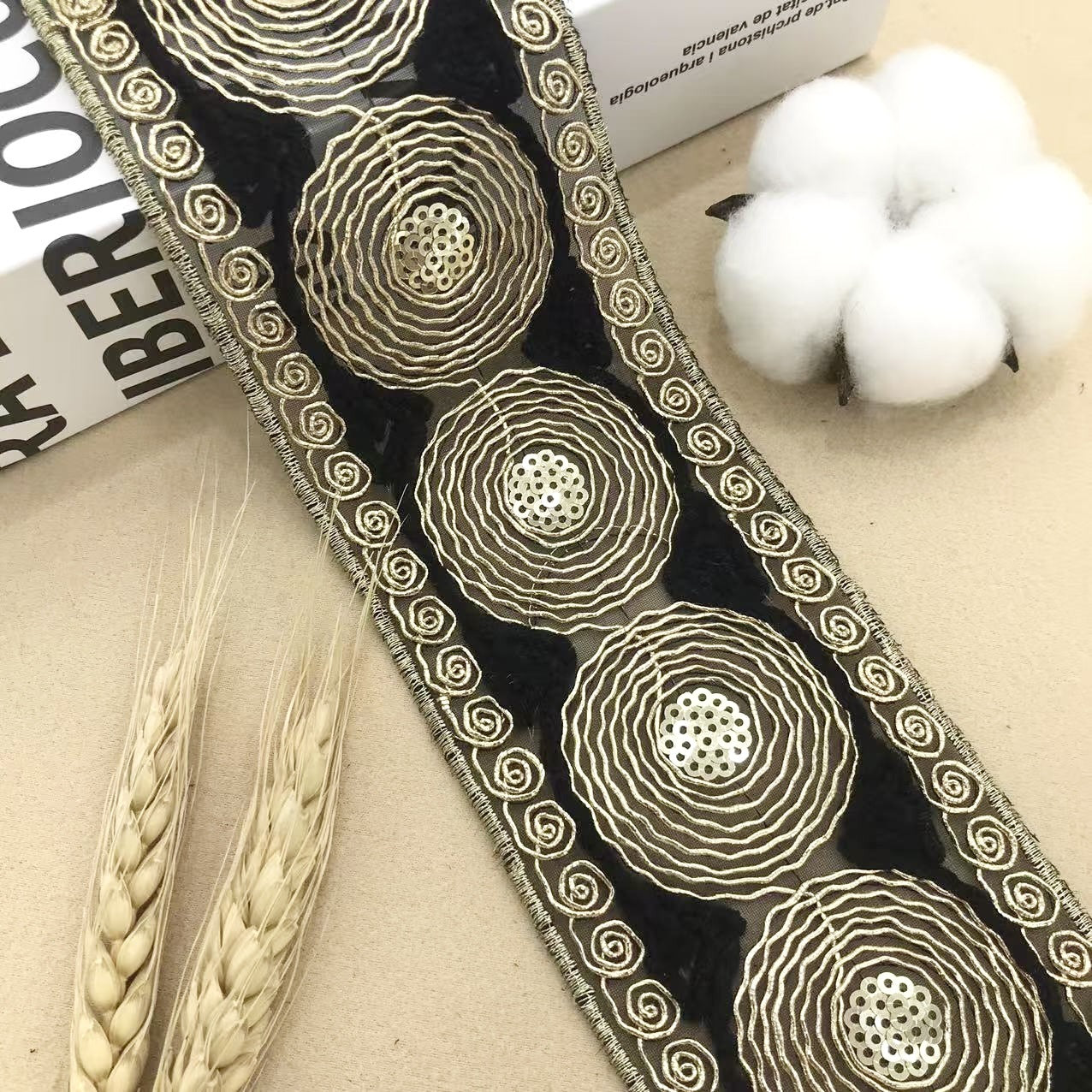 Black lace trim with circular embroidery and spiral edging, 6.5 cm wide