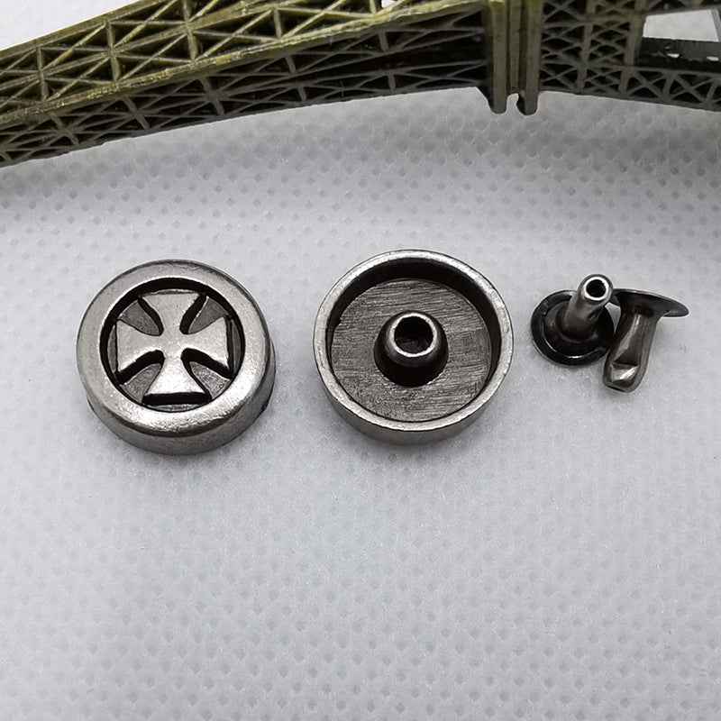 Round silver rivet studs with cross emblem in center, plus back plate with hole and post.