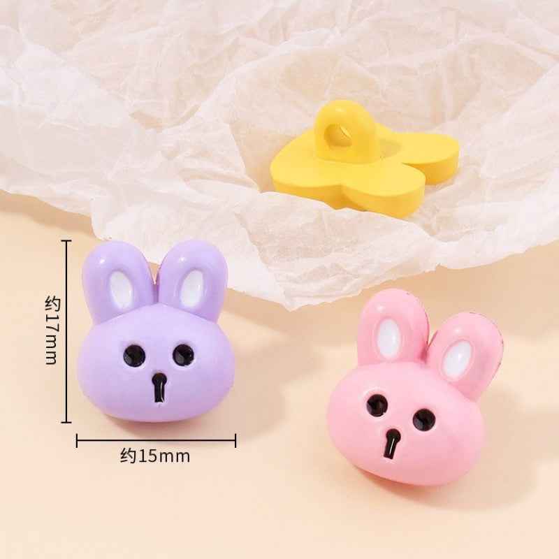 Single bunny resin shank button pair: purple and pink rabbit faces, approx. 15mm