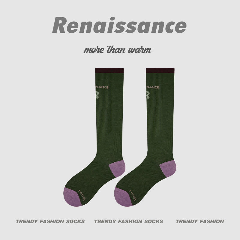 Dark green compression running socks with purple heel and toe accents, women’s crew