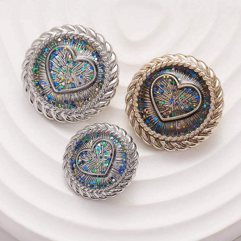 Set of heart metal shank buttons: two silver and one gold, braided rims, glitter centers