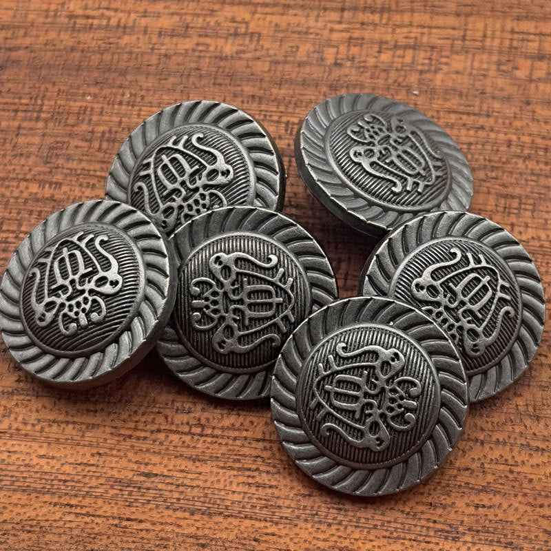 Vintage metal coat buttons, 20mm, dark gray with ornate crest front and ribbed edge