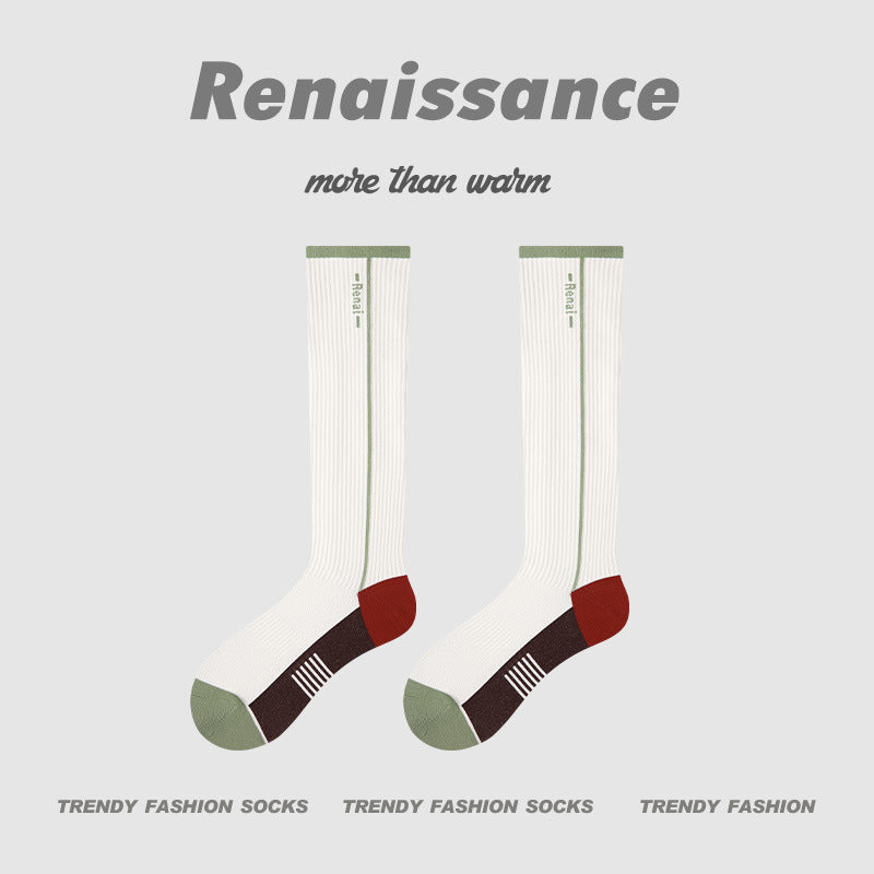 White compression crew running socks with green cuff and brown toe details, pair