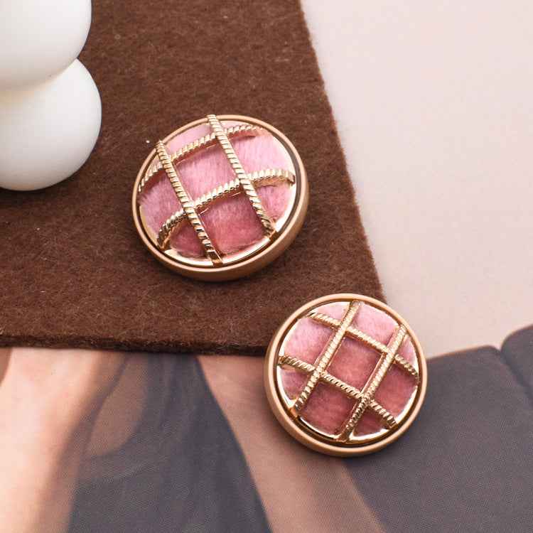 Pink fabric-covered sewing button, round with gold square cross stitching