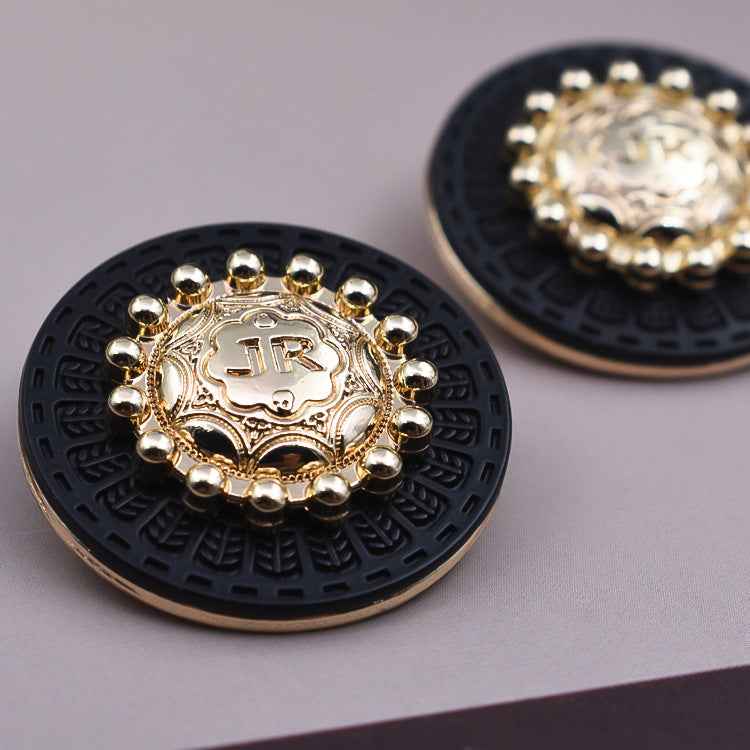 Round vintage metal shank button, gold center on dark base with bead border