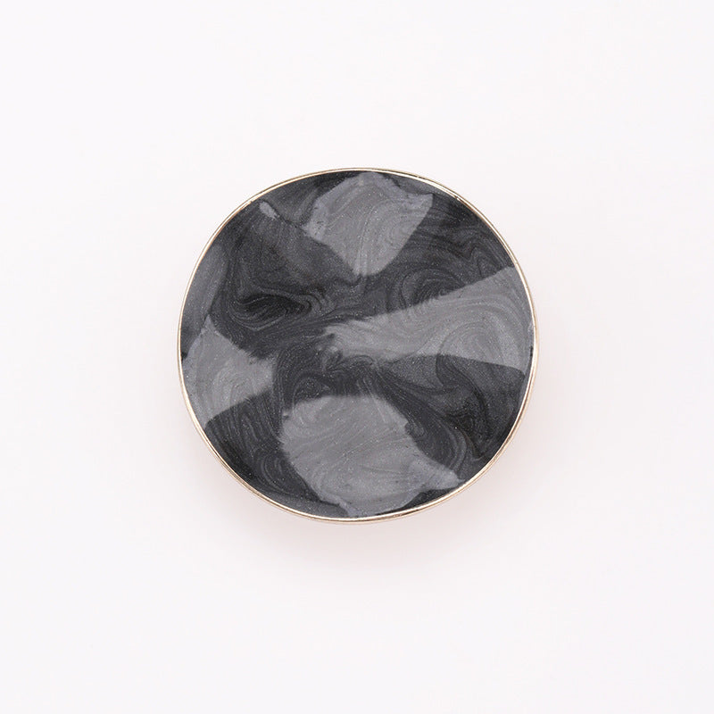 Black irregular dot oil coat button with metal rim and shank