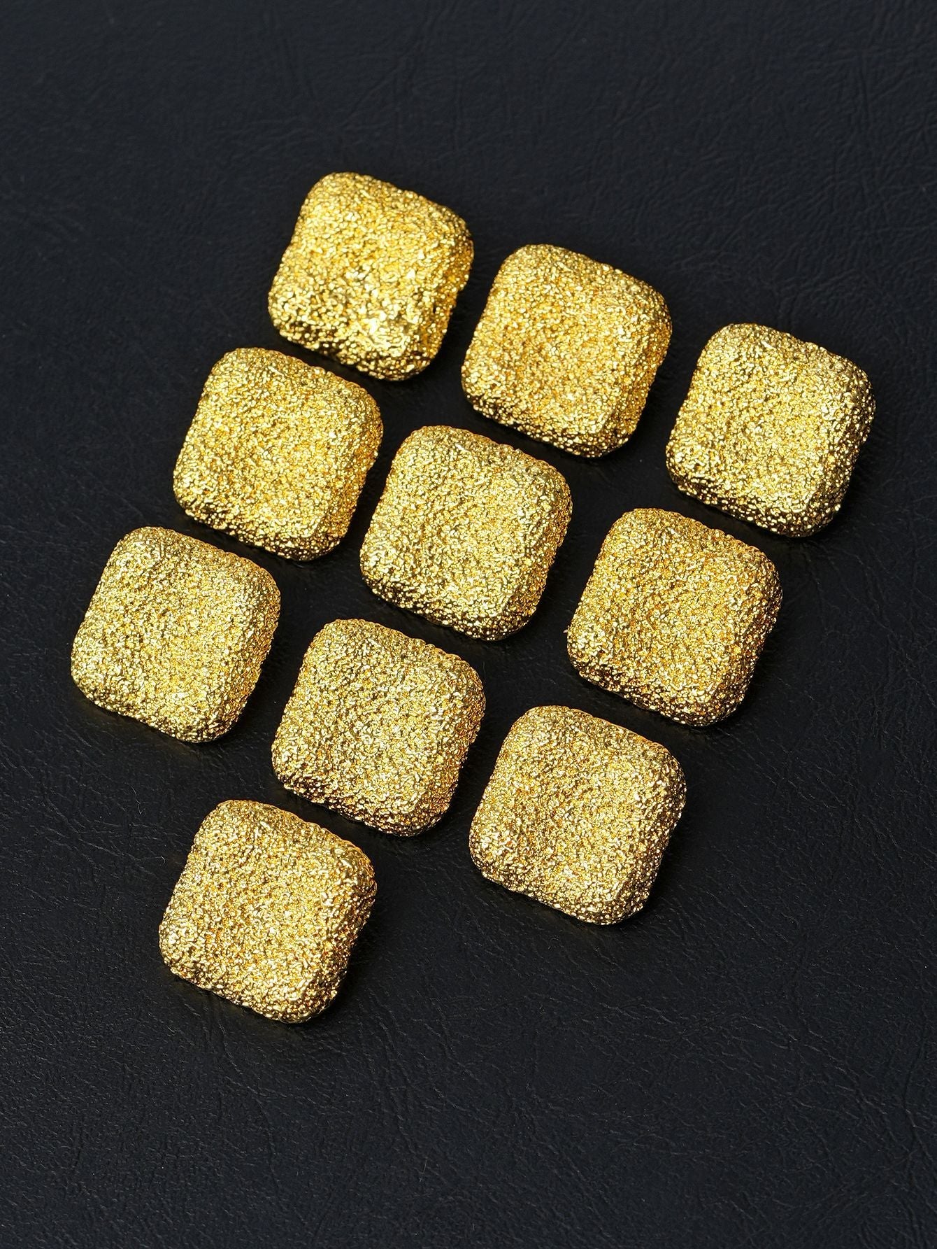 Square matte textured metal shank buttons in gold, assorted pieces
