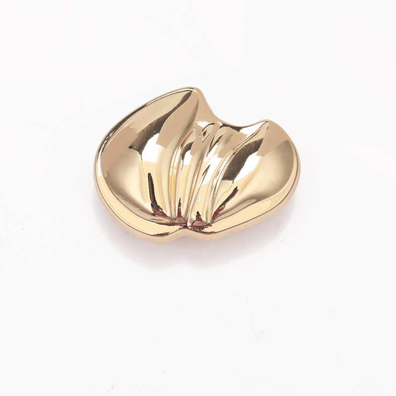 Paw-shaped metal shank button, light gold finish, curled paw detail