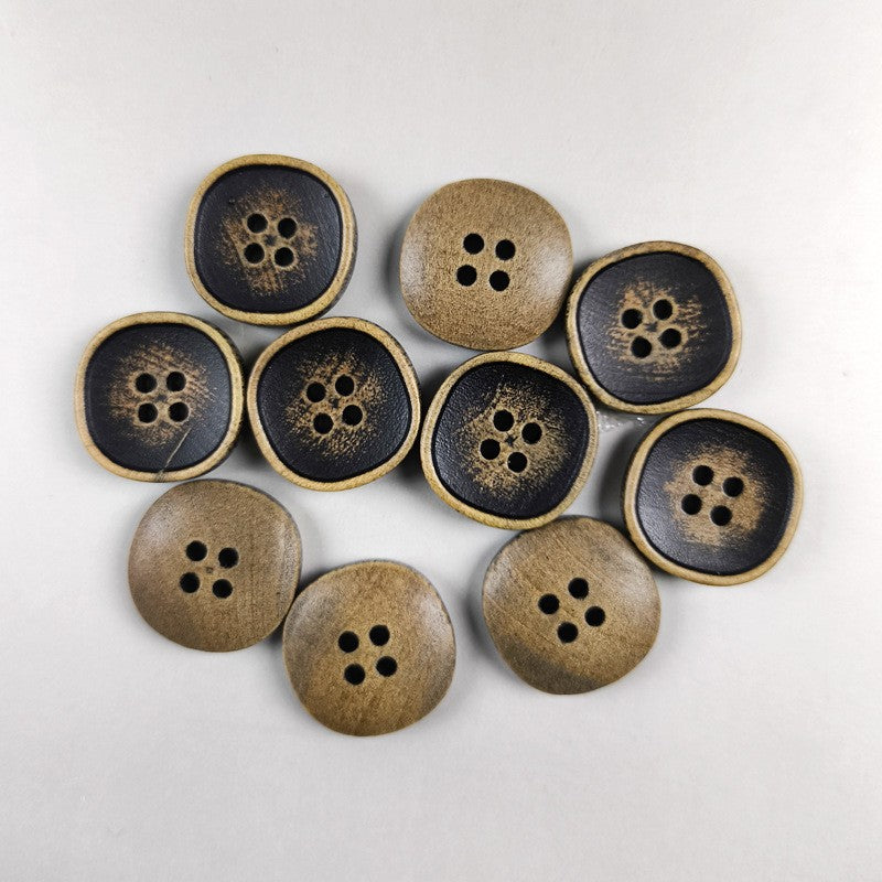Assorted round four-hole wood buttons in dark and tan tones