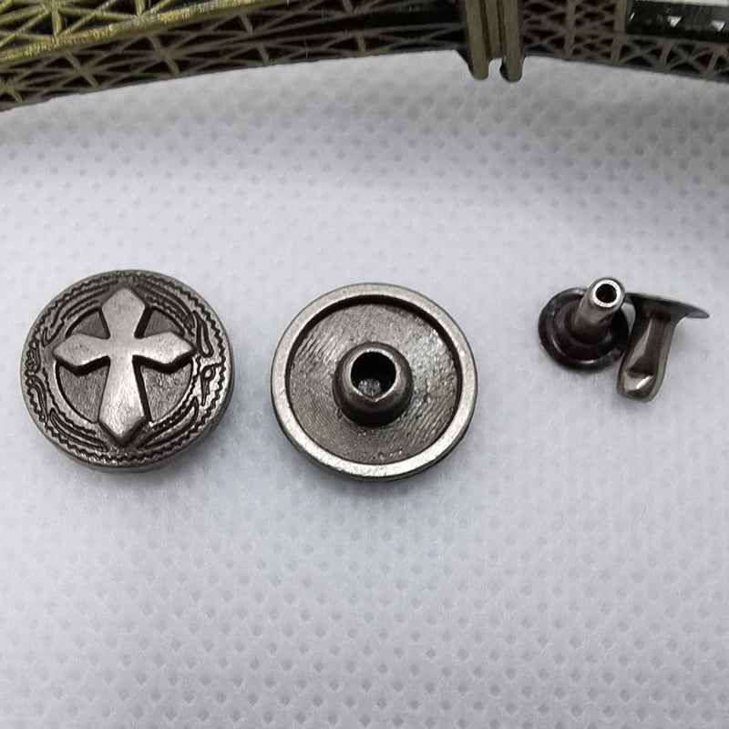 Round rivet stud with cross emblem, matching back plate, and one pointed stud post.